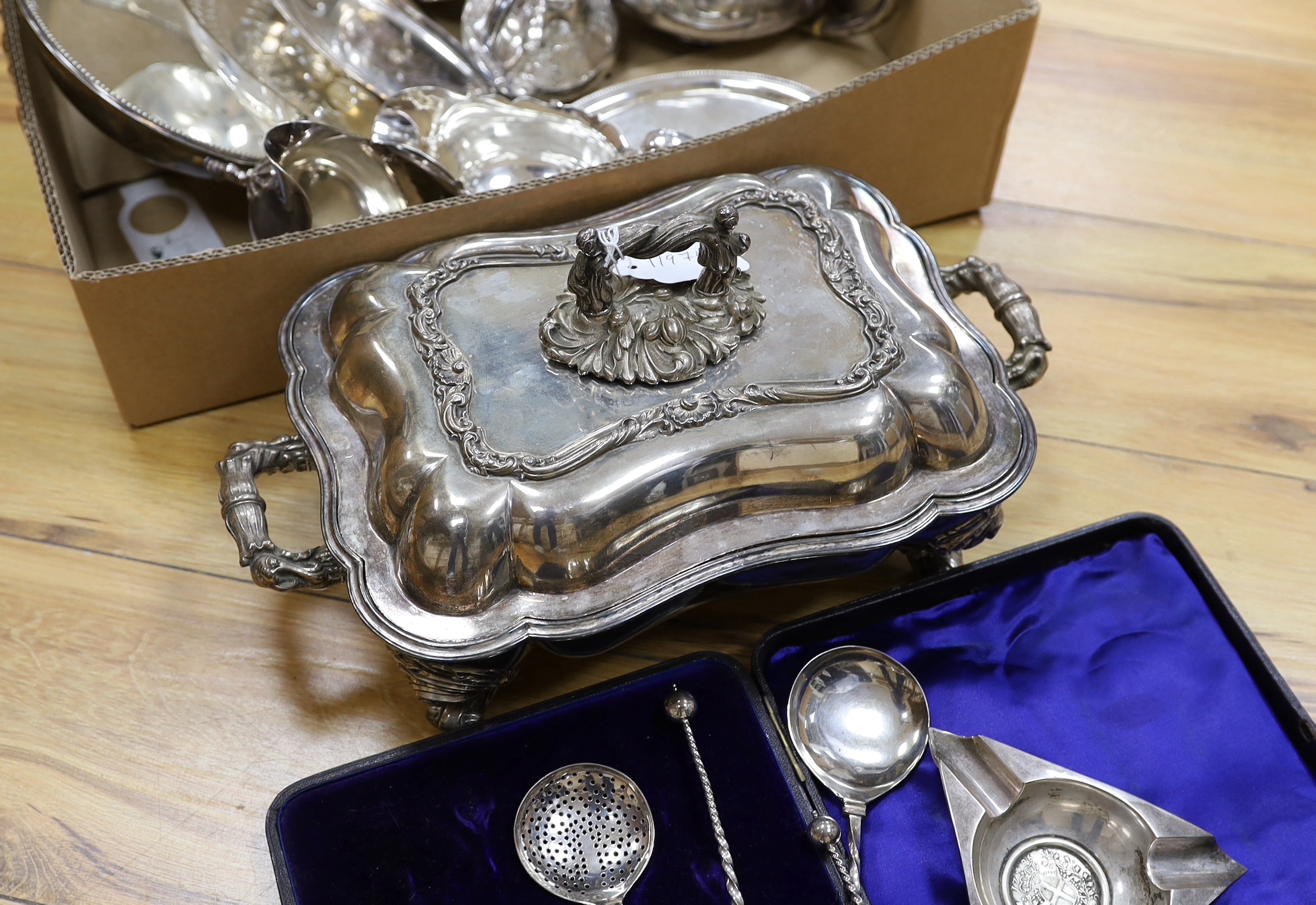 A collection of plated wares: an oval card tray, tureen and cover, cased four piece spoon desert set and an inset coin ashtray etc